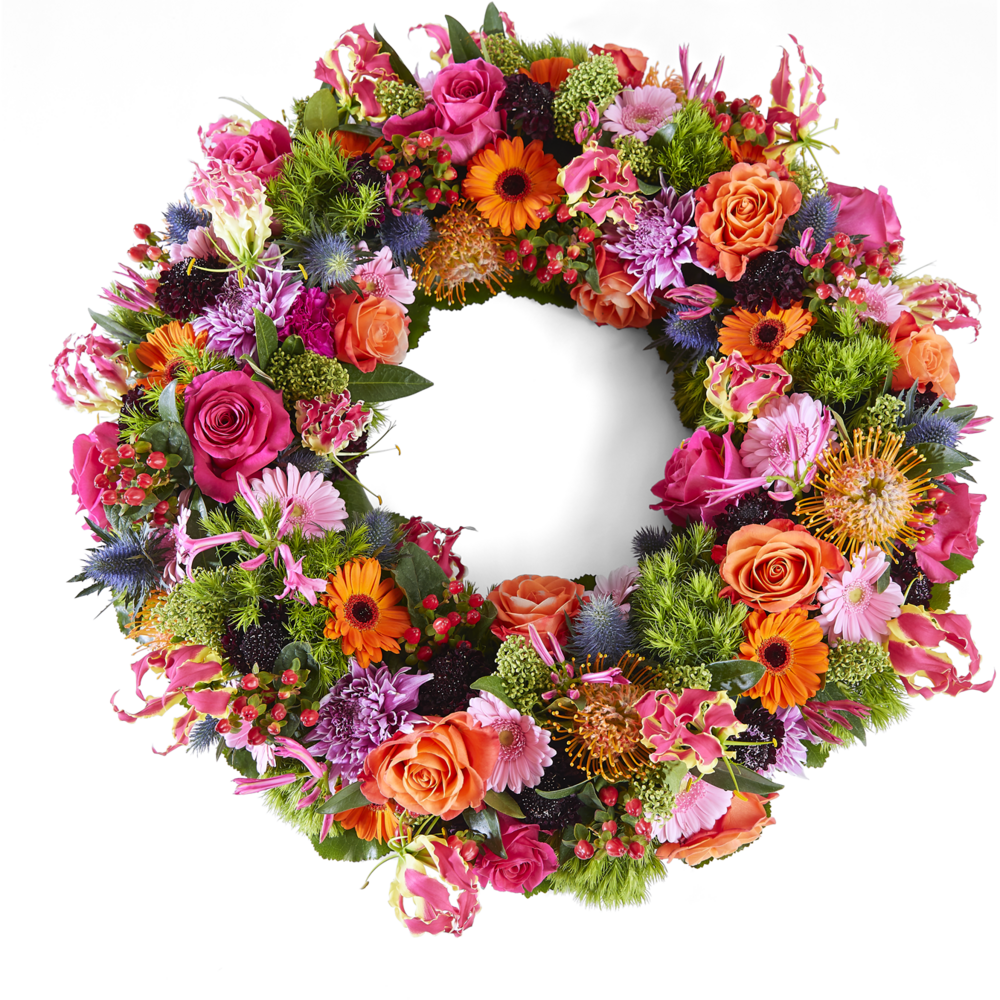 Rouwkrans met rozen, gerbera en warme, kleurrijke bloemen